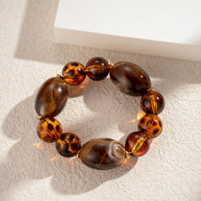 Elastisches Armband mit braune Perlen